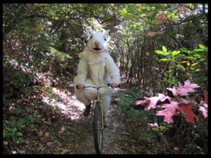 Michael biking around in his white squirrel costume!